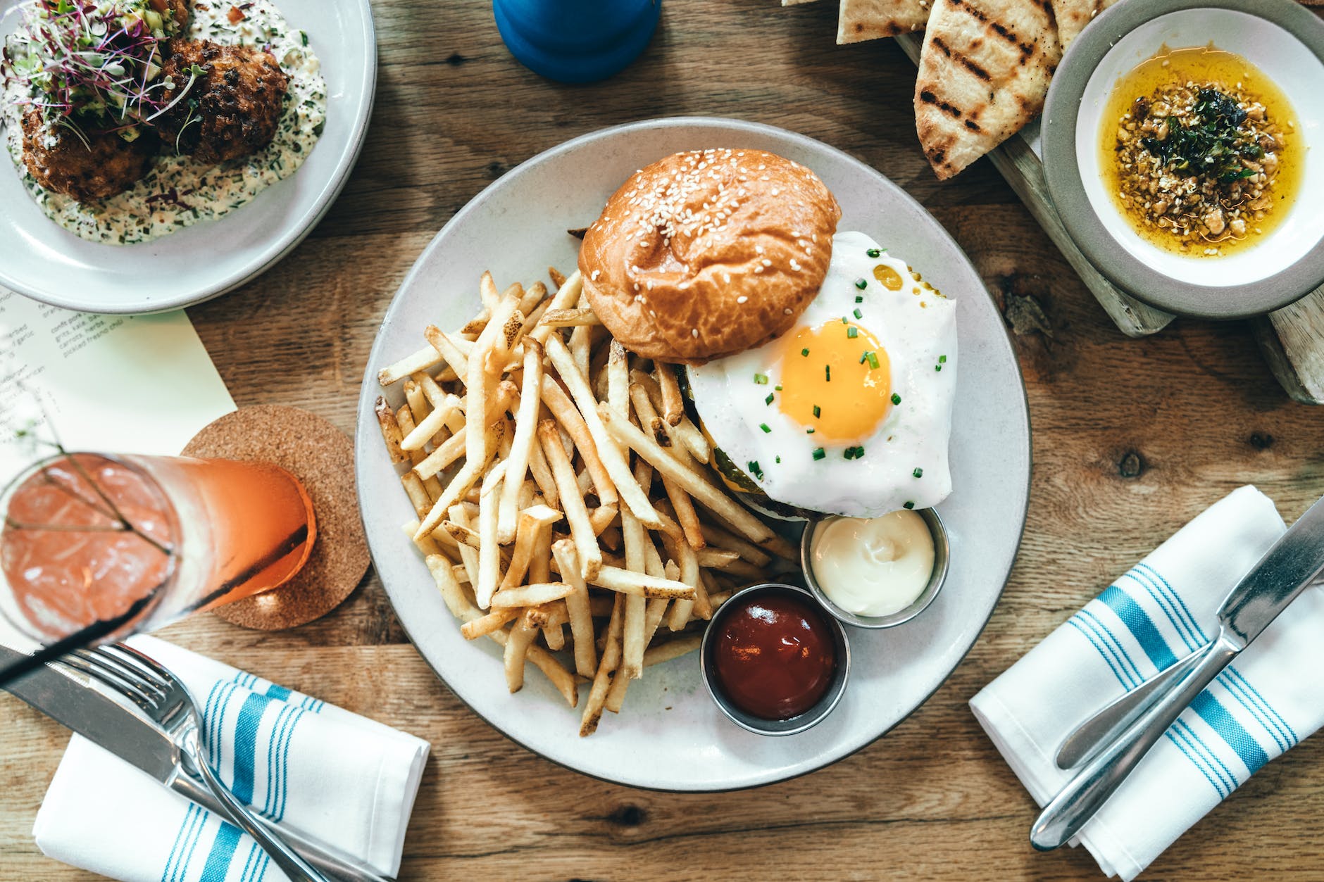delicious burger with fried egg and fries