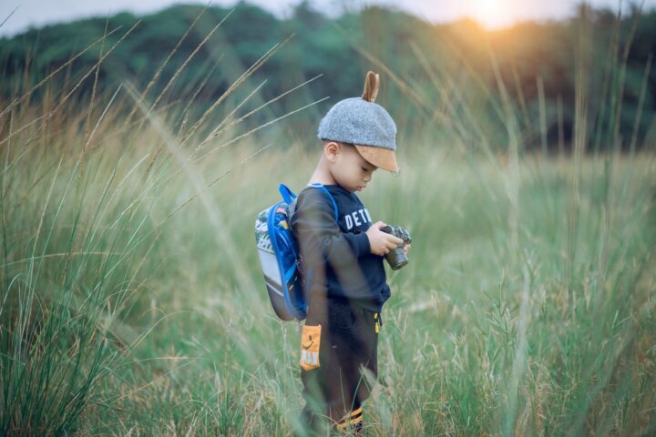 toddler holding camera