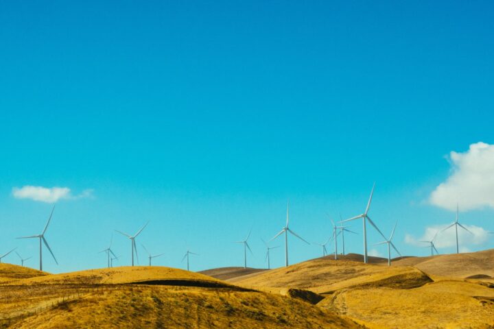 wind turbines under blue sky