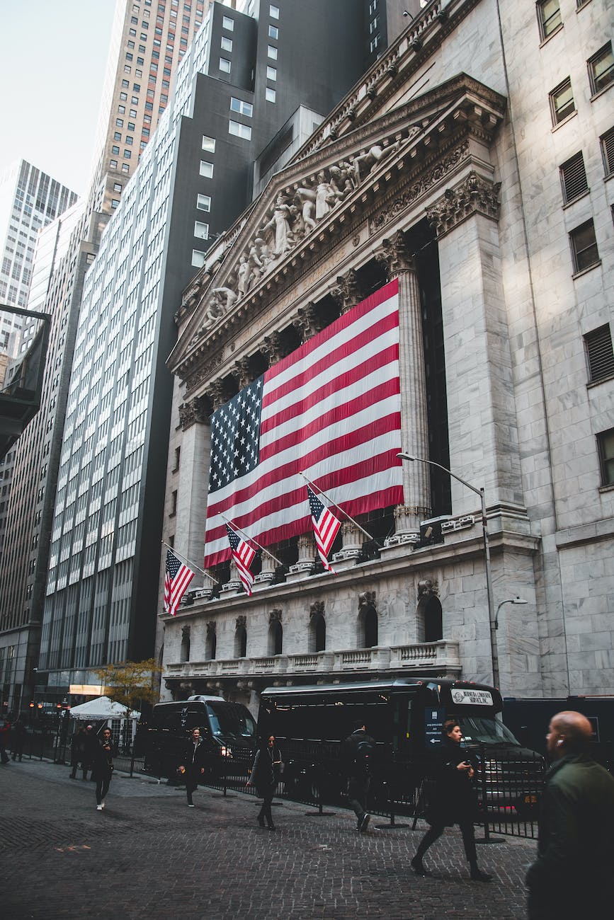 the american flag hanging outside the new york stock exchange
