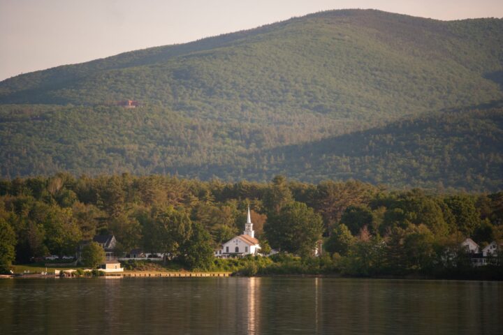 white church building near the mountain