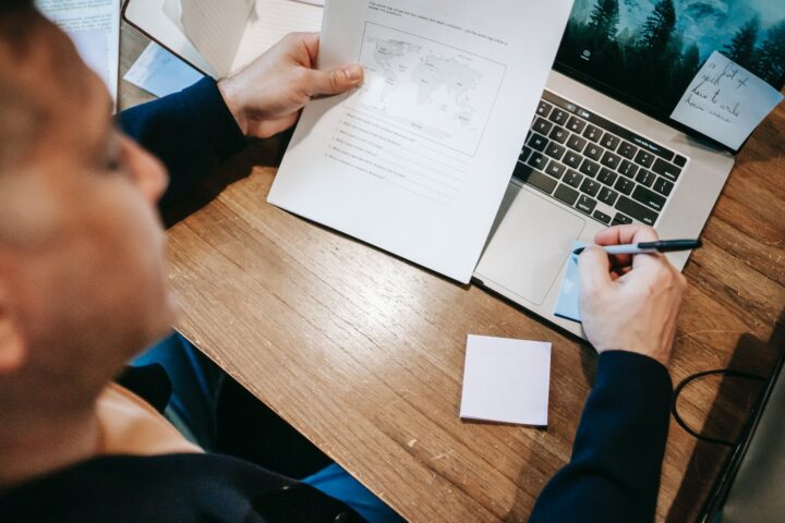 photo of person holding documents