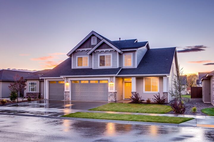 blue and gray concrete house with attic during twilight