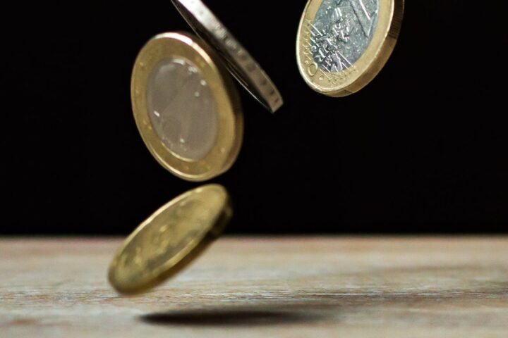 coins on brown wood