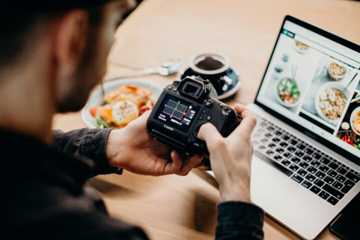 man holding dslr camera