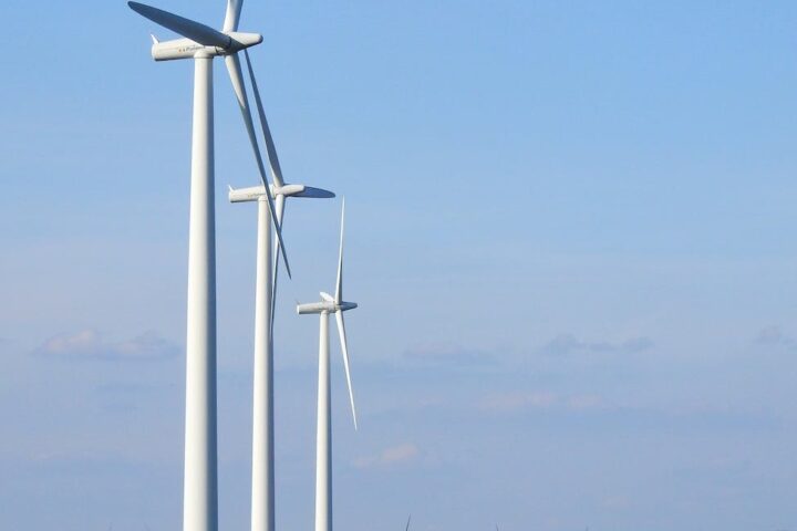 photography of three white windmills