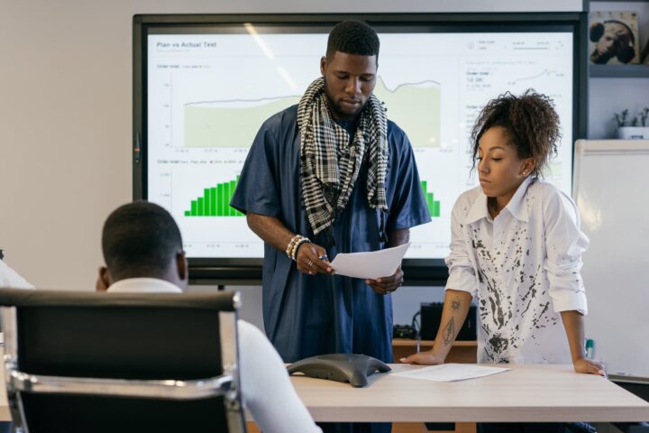 couple giving presentation at office