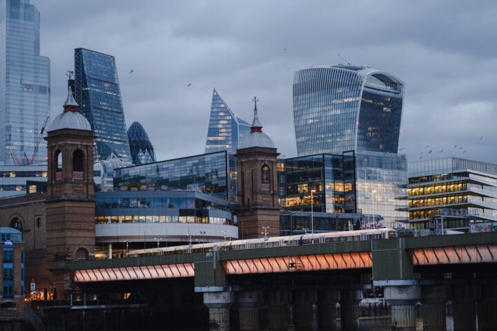 modern skyscrapers near bridge in london